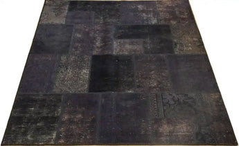 Heriz hand-knotted modern patchwork rug, 240x170 cm, showcasing intricate design and vibrant colors on a woven textile.