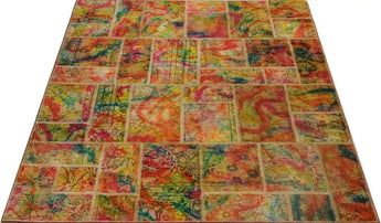 Handwoven modern patchwork rug by Heriz, 240x170 cm, featuring colorful geometric patterns and intricate stitching.