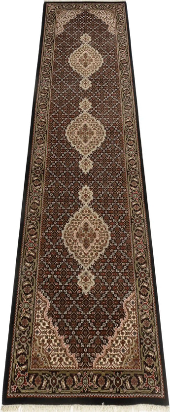 Handknotted Heriz Tabriz rug, 311x83 cm, with intricate Oriental design, showcasing detailed patterns and rich colors.