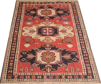 Handwoven Heriz Kelim rug in traditional Ottoman design, measuring 140x100 cm, showcasing intricate patterns and rich textures.